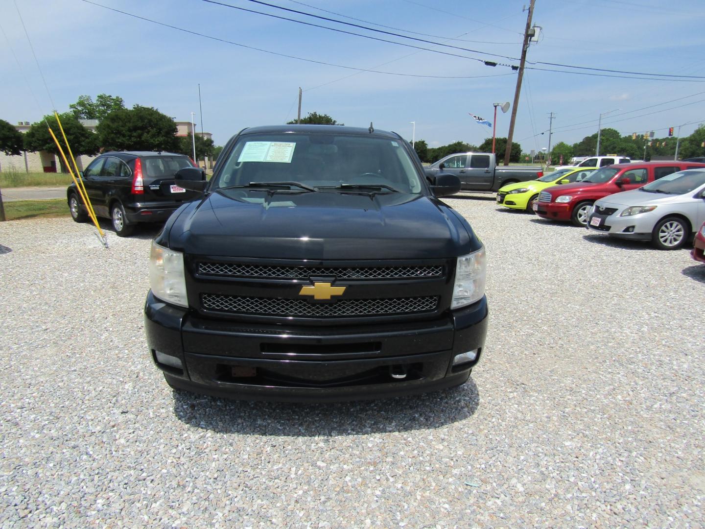 2011 Black /Tan Chevrolet Silverado 1500 LT Ext. Cab 4WD (1GCRKSE35BZ) with an 5.3L V8 OHV 16V FFV engine, Automatic transmission, located at 15016 S Hwy 231, Midland City, AL, 36350, (334) 983-3001, 31.306210, -85.495277 - Photo#1